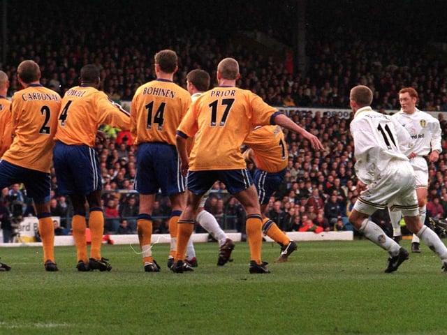 Jimmy Floyd-Hasselbaink bends the ball around Derby County's wall to score from a free kick during the Premiership clash at Elland Road in March 1999. PIC: John Giles/PA
