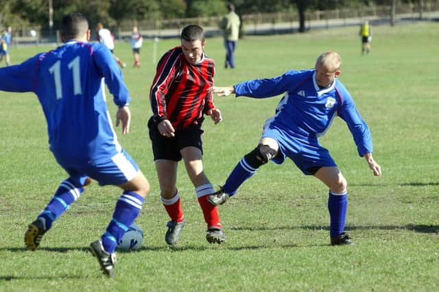 Chickenley v Merlins, 5 October 2003. Tony Cuffe of Chickenley of the Heavy Woollen Gate Alliance takes on the Merlins defence in the County Sunday Cup.