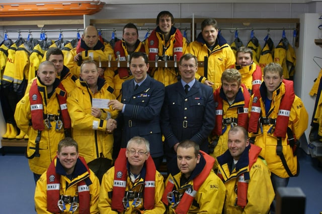 RAF Fylingdales present a cheque for £1,000 to Whitby’s lifeboat crew.