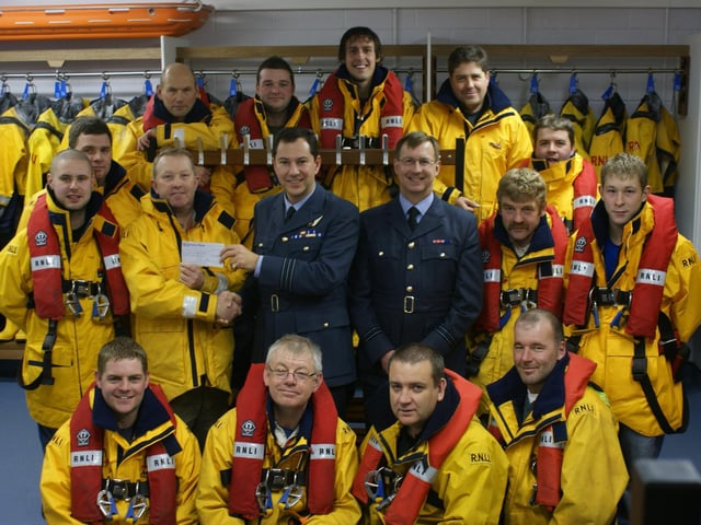 RAF Fylingdales present a cheque for £1,000 to Whitby’s lifeboat crew.