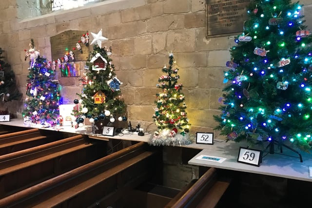 Colourful Christmas trees inside the church
