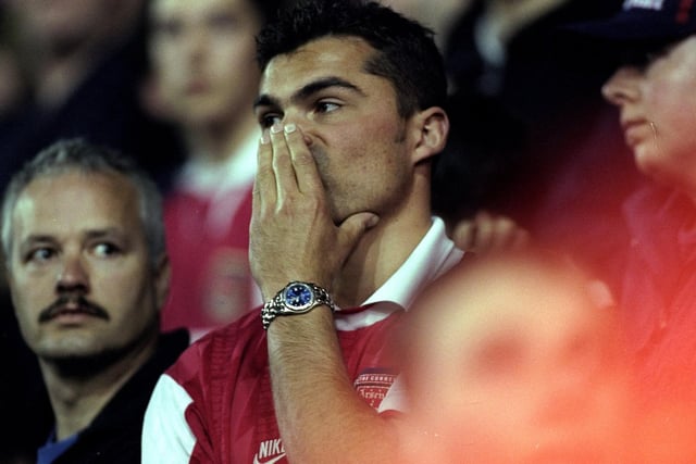 Arsenal fans are left dejected at full-time.