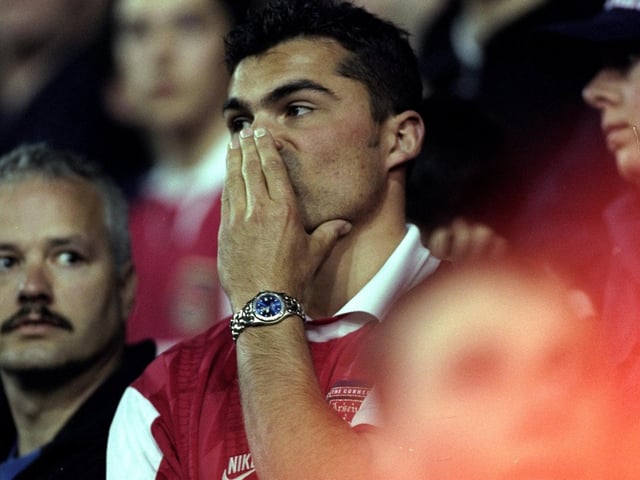 Arsenal fans are left dejected at full-time.