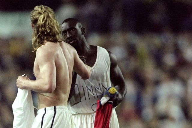 Arsenal's Emmanuel Petit swaps shirts with Jimmy Floyd Hasselbaink.