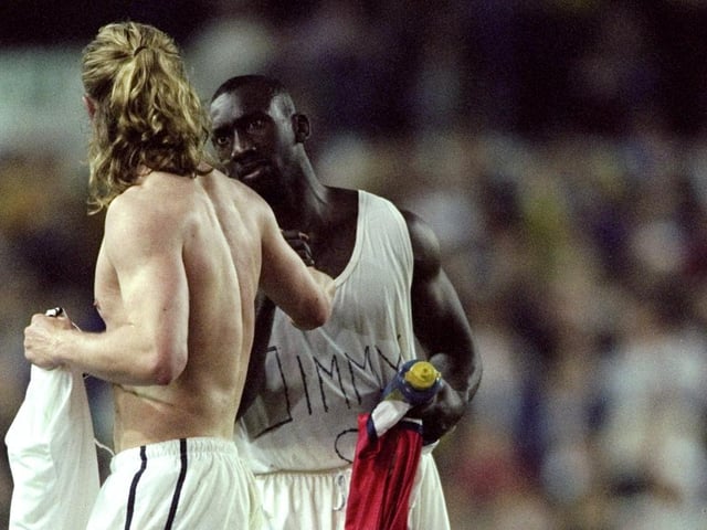 Arsenal's Emmanuel Petit swaps shirts with Jimmy Floyd Hasselbaink.