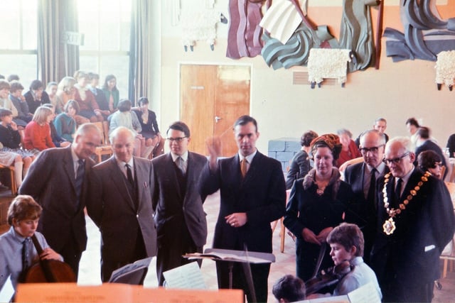 A group of visitors are pictured watching the school orchestra in December 1966. The Mayor of Morley, Bernard Haydn, can be seen to the right.