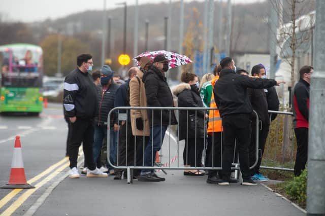 People queue to enter the Leeds Covid Vaccination Centre at Elland Road