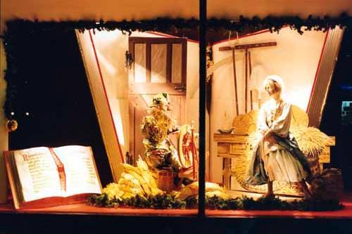 This Christmas display in Lewis's window possibly dates from the late 1970s or early 1980s. Lewis's were well known for their elaborate displays, particularly the ones for children like this one depicting a scene from the fairy story Rumpelstiltskin. Here the miller's daughter watches gratefully as the little man spins the straw into gold.