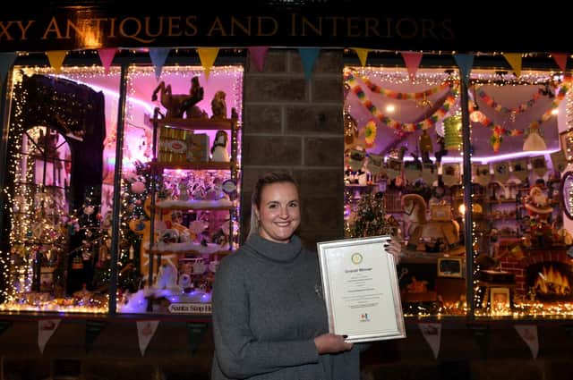 Overall winner of the Harrogate BID/Rotary Club of Harrogate festive window competition Alex Clarke of Foxy Antiques and Interiors
