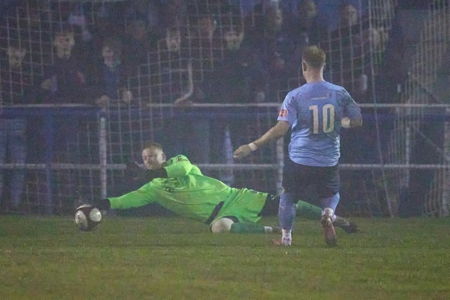 Pontefract Collieries goalkeeper Lloyd Allison makes a great save to deny Ossett United's James Walshaw.