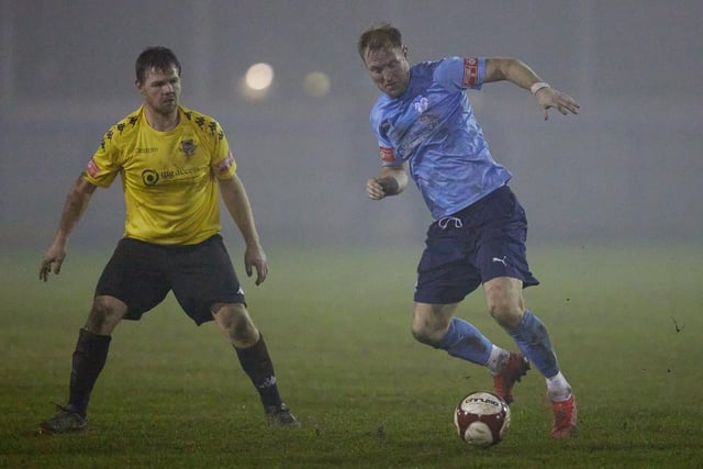 Ossett United's James Walshaw on the attack against Pontefract Collieries.