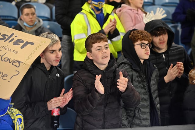 Young Leeds fans clap their team at Elland Road.