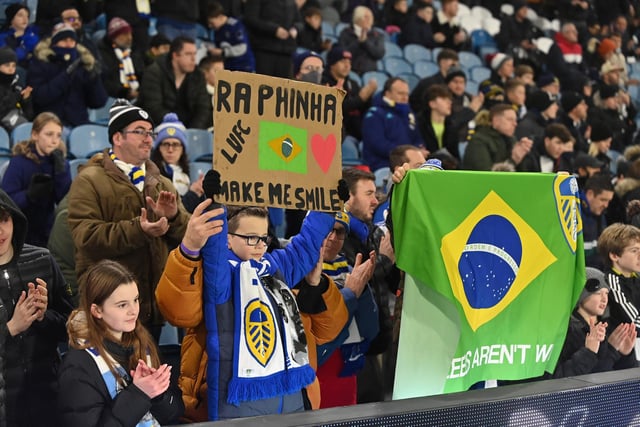 Young fans show their support for the Whites' number 10.