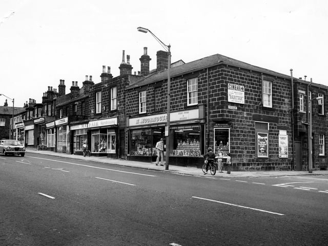 Otley Road in June 1980 showing the junction with Cottage Road on the right. Shops in the picture include H. Moorhouse, grocers, then Mayfair Fashions and J. C. Cook, butcher. There is an advertisement for Cottage Road Cinema, which is showing the film 'Agatha'.