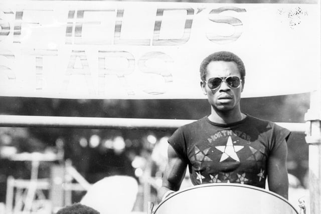 A pan player with Huddersfield's North Stars Steel Band is pictured at the 13th Leeds West Indian Carnival. The photograph was taken in Potternewton Park, the assembly point for the bands, troupes and individuals taking part in the carnival procession on August Bank Holiday Monday, 1980. Picture by C E Shaw.