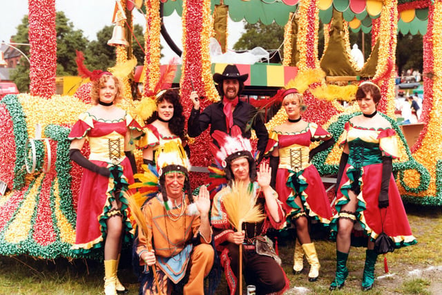 Proud members of Lewis's 'Fells Wargo Railway Co.'(A humorous play on words with reference to 'Wells Fargo', of course). They pose in their colourful costumes in front of the spectacular decorated steam engine of the American West. This was Lewis's entry to the 7th Lord Mayor's Parade in June 1980 for which it won Best Overall Entry.