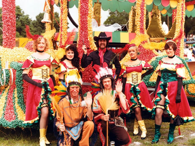 Proud members of Lewis's 'Fells Wargo Railway Co.'(A humorous play on words with reference to 'Wells Fargo', of course). They pose in their colourful costumes in front of the spectacular decorated steam engine of the American West. This was Lewis's entry to the 7th Lord Mayor's Parade in June 1980 for which it won Best Overall Entry.
