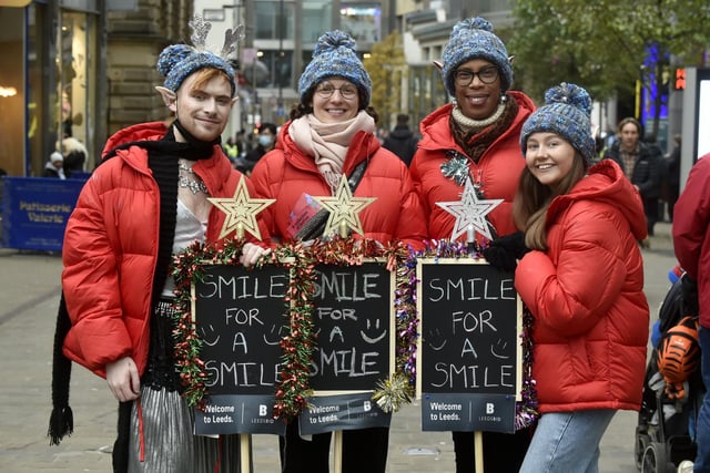 The Welcome to Leeds team give shoppers a smile before Christmas