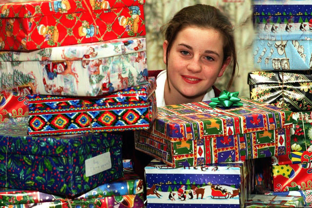 Pru Fowler, 16, a pupil at Harrogate Ladies College with some of the Christmas Presents she has encouraged classmates to collect to send to Bosnia