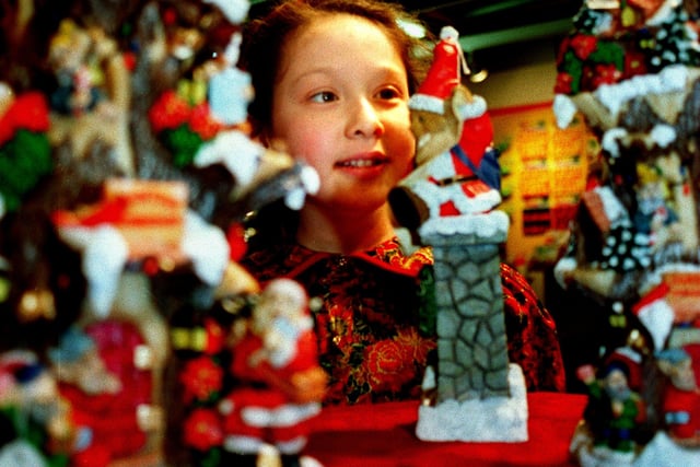 A child looks at some of the Christmas decoration at the Harrogate Toy Fair.