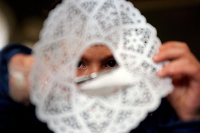 Robert Ellis, 7, makes a snowflake during a Christmas activities day at the Pump Rooms, Harrogate.
