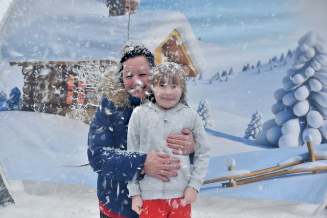 Enjoying fun in the snow globe at the Team Reece Winter Wonderland are Doreen McGuire and Millie.