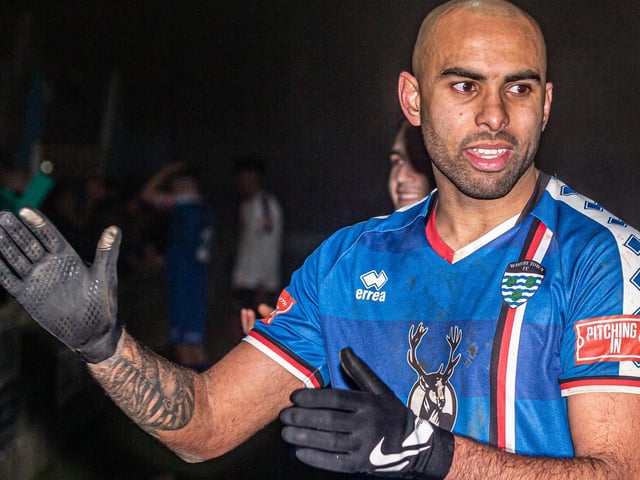 Jacob Hazel applauds the Whitby Town fans after their 3-0 home win against Grantham Town
Photo by Brian Murfield