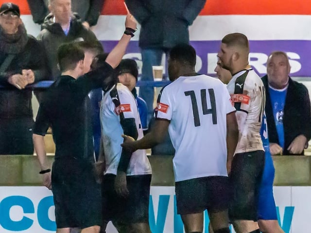 Grantham Town's Glenn Yala is sent off for a challenge on Whitby Town's Malik Dijksteel, who is on loan from Middlesbrough FC.