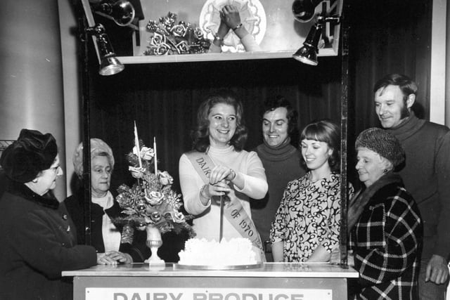 The YEP Women's Circle met at the Hotel Metropole in Leeds city centre in December 1970. Pictured are, from left, Gertrude Hart,  Alice Atkin, Julie Greenleaf, the National Dairy Queen cutting the Women's Circle Christmas cake,  Edward Elfes, of Eric Nunns, florists, Rosemary Sloan, Dairy Produce Adviser, Milk Marketing Board, Laura Crowther and Eric Nunns.
