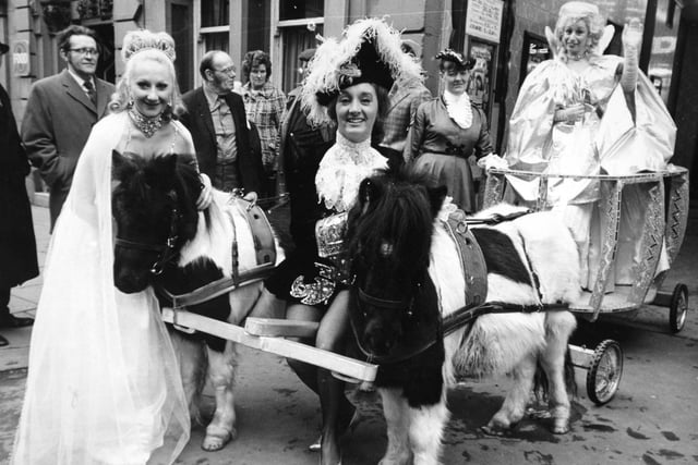 Cinderella's coach arrives at Leeds City Varieties on The Headrow in December 1974 ahead of the pantomime. Pictured with the coach are, at front, Annette Cotton (fairy) and Gerrie Raymond (Prince Charming). At the back are Marsha Harris (Cinderella), in coach, and (in the background), Sheela Allen (Courtier).