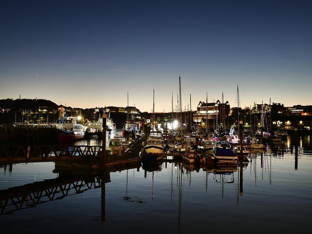 Christmas lights on boats in the harbour.