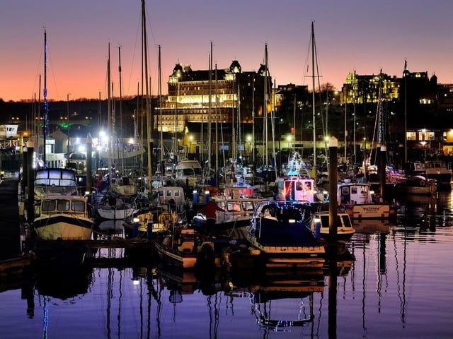The Grand overlooks the harbour boats...