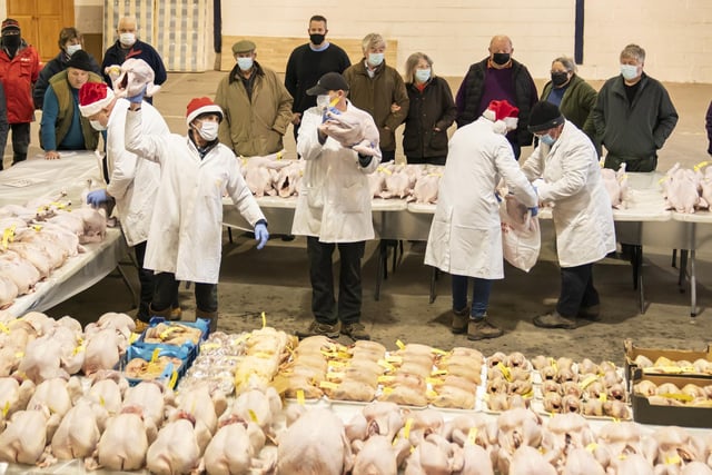 Butchers, wholesalers and members of the public, flocked round to bid on the birds.