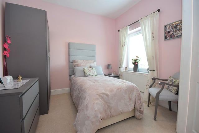 A further bedroom is double sized but used here as a delightful single.