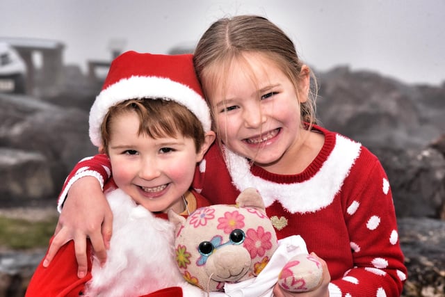Morecambe Santa Dash. Dylan Ansell (4) and Evie Peters (6). Picture by Julian Brown /JPIMedia 19/12/21.
