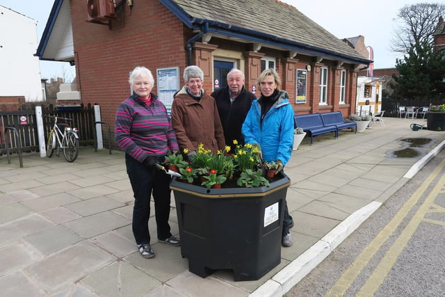 Tony Ford and St Annes In Bloom volunteers Margaret Beddows,  Diane Smith and Janet Fielding with new planters at St Annes station
