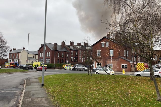 Fighfighters are tackling the blaze, affecting a single story of a commercial building on Cross Lane