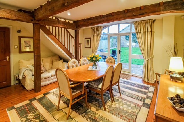 This spacious yet cosy room has French doors out to the garden.