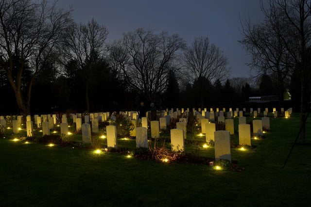 Tea lights light up the war graves