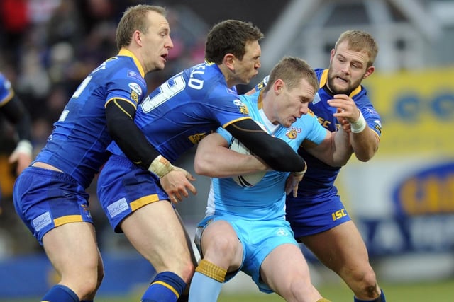 More 2011 action as then Leeds Rhinos players Carl Ablett, Kevin Sinfield and Paul McShane team up to halt Matt Blaymire.