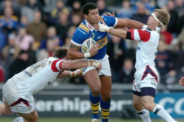 Danny Sculthorpe and Sam Obst tackle Leeds' Ryan Bailey in 2007.
