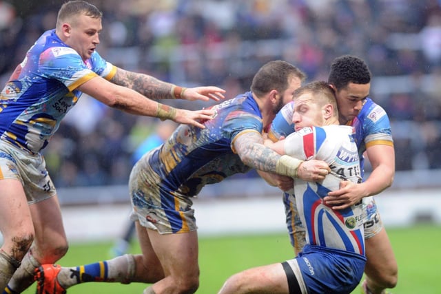 Andy Yates in action as he takes a tackle in Wakefield Trinity's winning Festive Challenge in 20-15.