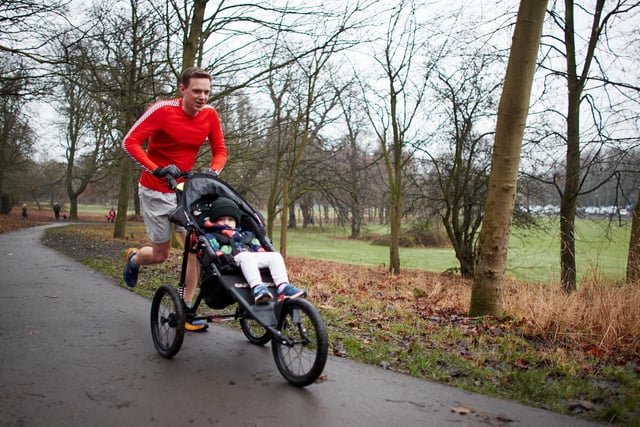 A runner and rider at the Wakefield Thornes Parkrun.