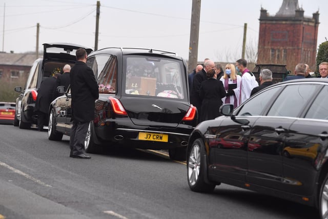 The cortege arrives at the church.