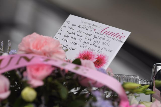 One of the messages left with floral tributes.