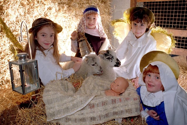 Pupils from St Agnes School in Headingley rehearse for their nativity play in December 1997 with the use of real animals. Pictured, from left, are Chantelle Watson, Richard Hartley, Sophia Wasti and Ellen Naylor.