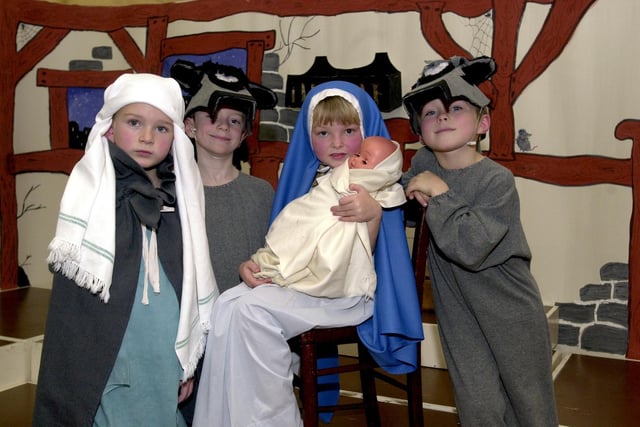 Waterloo Infant School in Pudsey staged a nativity play called 'Derek the Donkey' in December 2002. Pictured, from left, are Charlie Auty as Joseph, Jamie Walker as Derek the Donkey, Kiera Colman as Mary and Daniel Catherside as Daniel the Donkey.