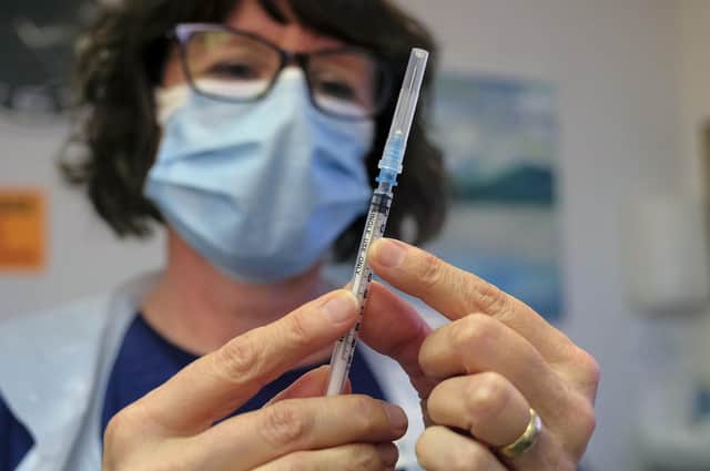 A nurse in Scarborough borough prepares to give a Covid vaccination.