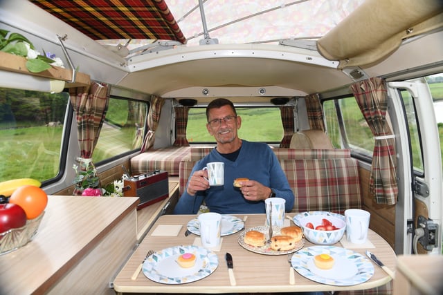 31st May 2021.
35th Yorkshire Classic Vehicle Show at Ripley Castle, Harrogate.
Pictured Rick Hutchinson enjoys a scone and tea in his 1972 VW Dormobile Camper called Lola
Picture Gerard Binks