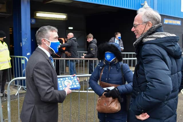 Wigan Athletic supporters who made the long trip to Oxford last weekend were greeted on arrival by chief executive Mal Brannigan, who handed over Christmas cards signed by the players